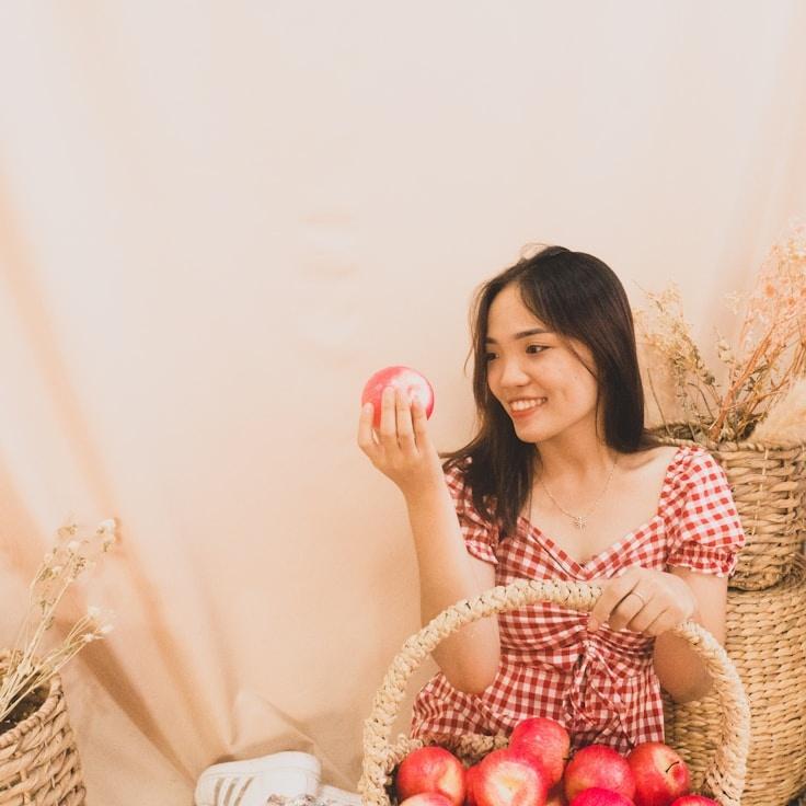 Avery Chen, Lead Design Curator at Radiant Stream Platform, reviewing corporate floral arrangements